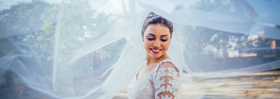 Bridal portrait with a flying veil over her head